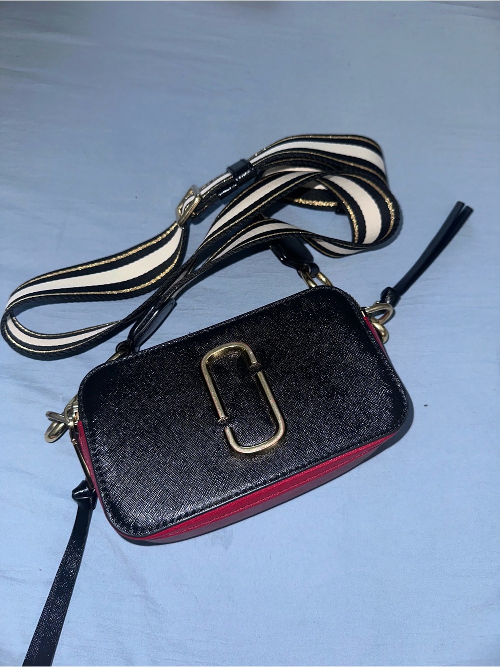 Marc Jacob’s Black and Red Crossbody Camera Bag with Gold Hardware